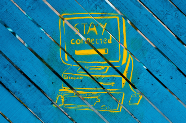 Graffiti of computer with 'Stay Connected' written onscreen
